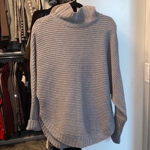 Curved chunky knit sweater